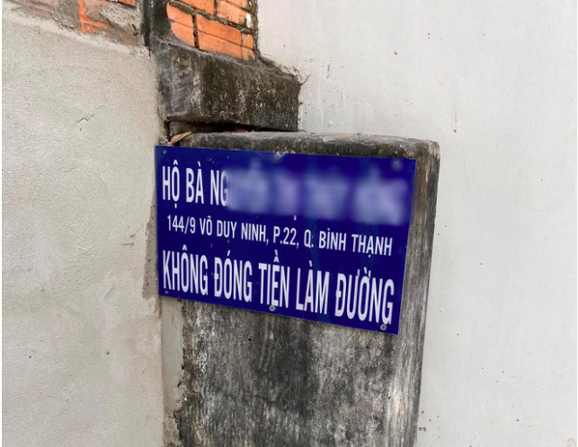 Không đóng tiền làm đường, hộ dân ở TP.HCM bị bêu tên - 1