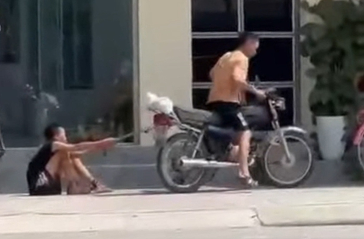 Phẫn nộ hình ảnh bé trai bị bố xích chân kéo lê trên đường phố Hải Phòng