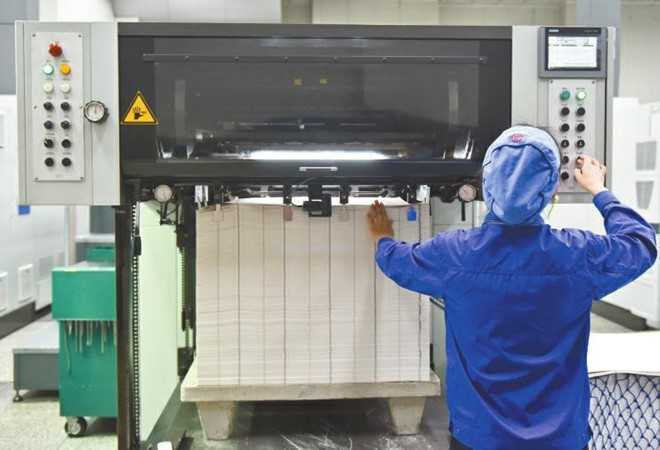 Hoat dong trong nha may in tien Trung Quoc hinh anh 6