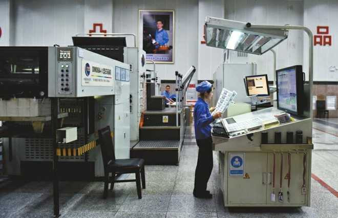 Hoat dong trong nha may in tien Trung Quoc hinh anh 7