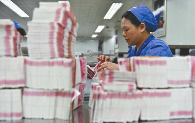 Hoat dong trong nha may in tien Trung Quoc hinh anh 8