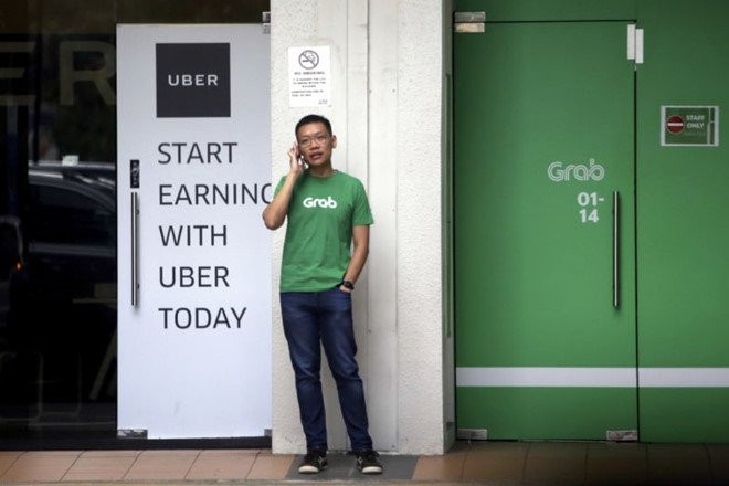 Thuong vu Grab mua Uber co kha nang bi Singapore huy bo hinh anh 1