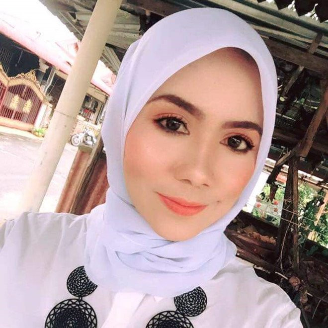 Nu giao vien xinh dep duoc khen ngoi vi cong hoc sinh qua nuoc lu hinh anh 2