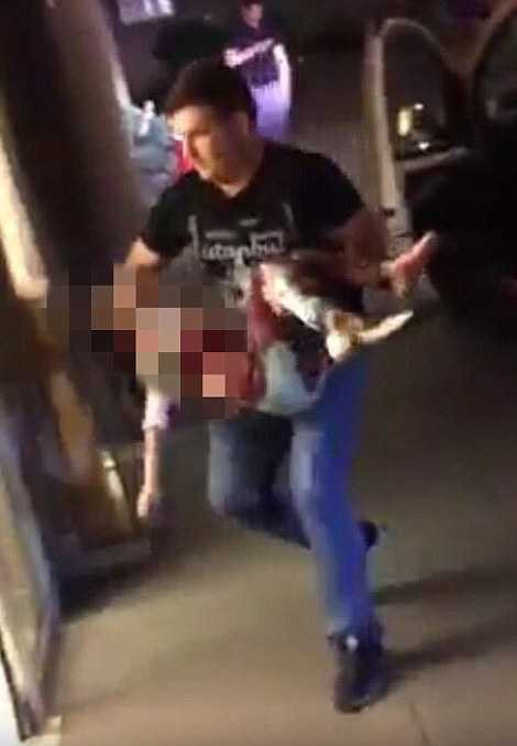 35C3AD2600000578-3664710-A_man_carries_a_wounded_boy_away_from_the_devastated_airport_ton-m-50_1467159855540