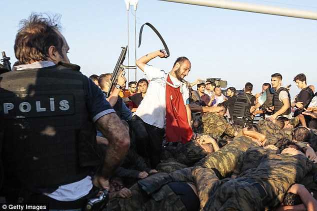 36555E0F00000578-0-A_Turkish_civilian_whips_soldiers_with_his_belt_after_they_surre-a-91_1468769592538