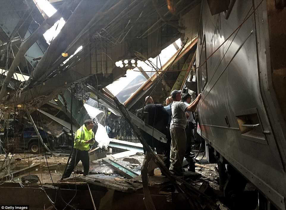 38EBB58900000578-3813781-NJ_Transit_employees_look_at_the_damaged_to_the_train_Part_of_th-a-60_1475157471649