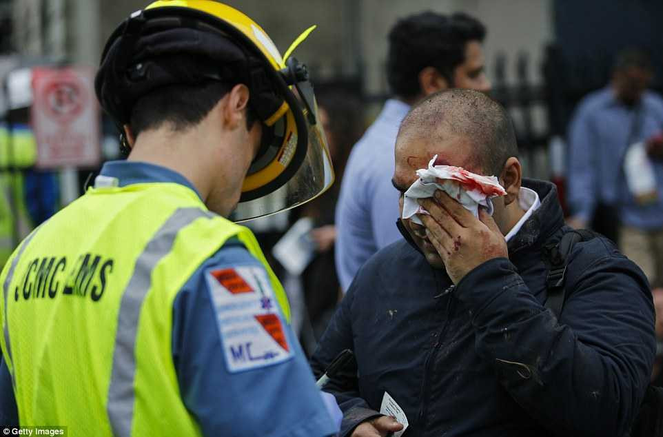 38EBDE5A00000578-3813781-A_commuter_holds_a_bloody_tissue_to_his_face_as_he_talks_to_a_me-a-66_1475159199101