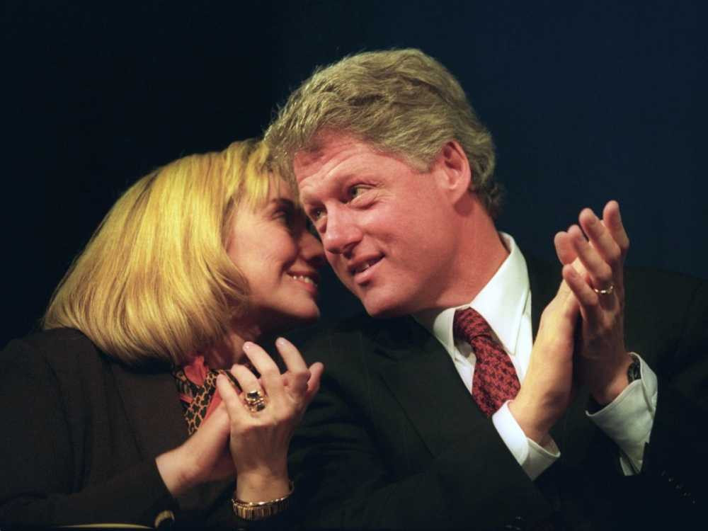 hillary-clinton-whispers-to-then-president-elect-bill-clinton-at-a-dinner-several-days-before-his-first-inauguration-in-1993