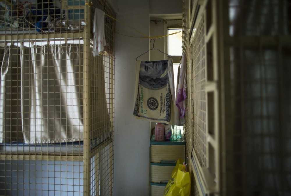 another-style-is-the-cage-home-a-stackable-six-foot-by-two-foot-wire-box-also-located-in-hong-kong