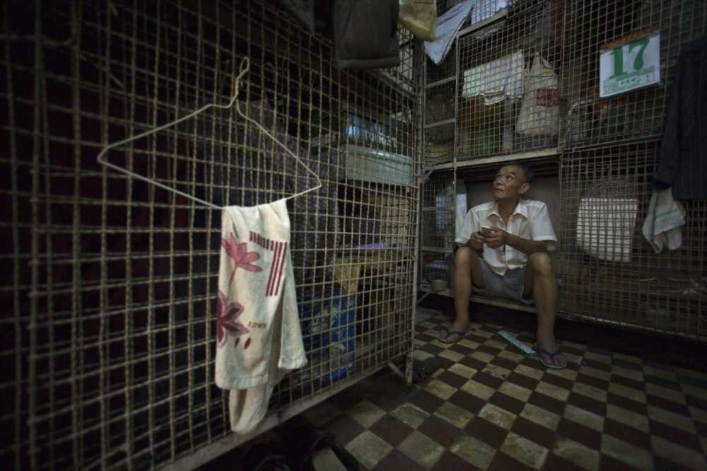 hundreds-of-elderly-men-such-as-kong-siu-kau-live-in-these-conditions-in-one-such-building-up-to-12-men-can-live-together-in-tightly-packed-cages
