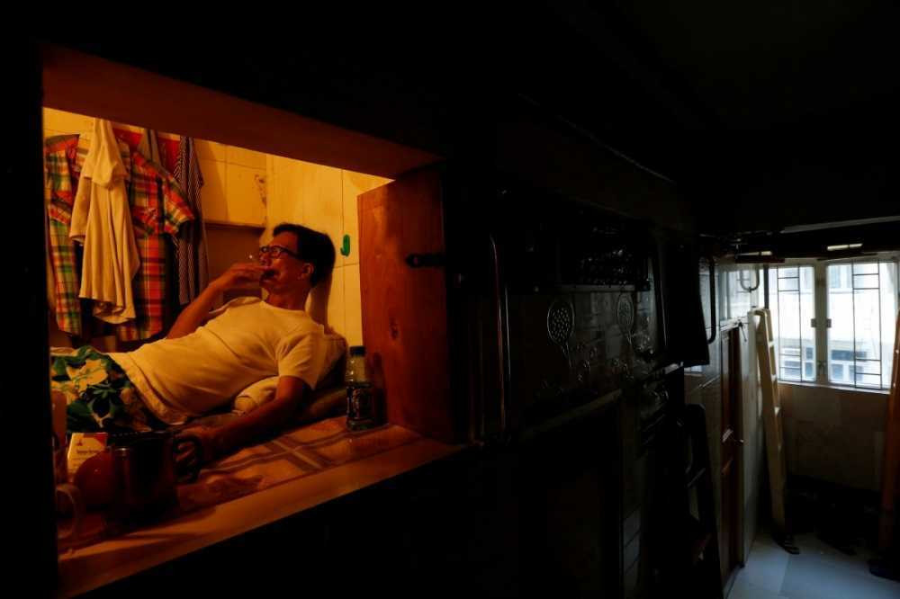 simon-wong-an-unemployed-61-year-old-man-also-living-in-hong-kong-lives-in-a-4x6-box-hes-one-of-many-residents-living-in-coffin-homes