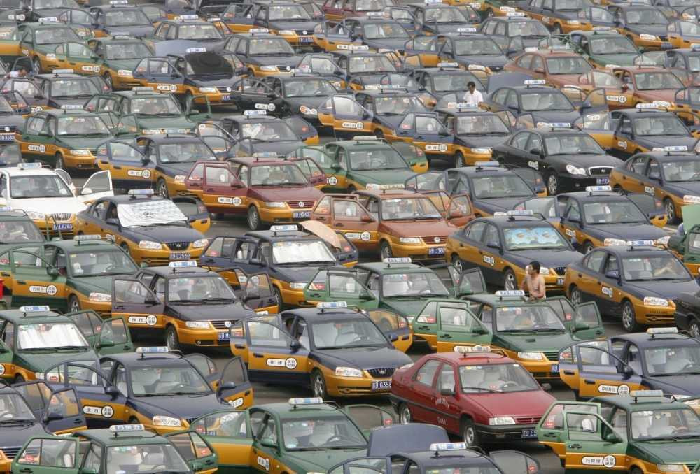taxi-drivers-line-up-in-a-parking-lot-while-waiting-for-passengers-at-the-new-beijing-capital-international-airport-0115 7