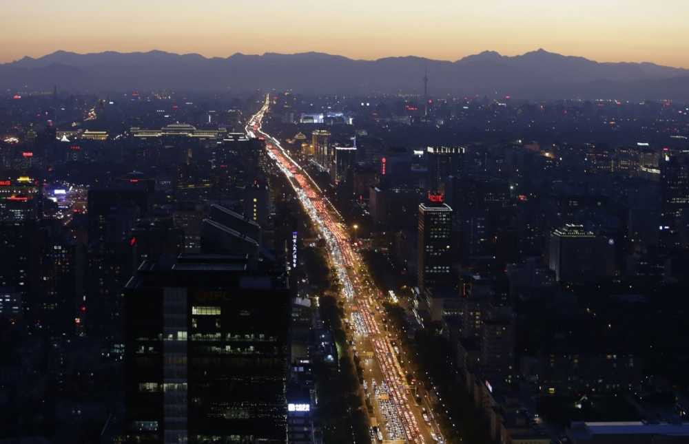 vehicles-are-seen-on-a-main-beijing-avenue-during-the-evening-rush-hour-0123 12