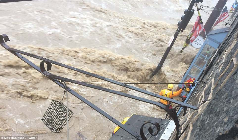 4CB0573F00000578-5777789-Authorities_started_to_carry_out_water_rescues_in_the_streets_wi-a-27_1527476397733 10