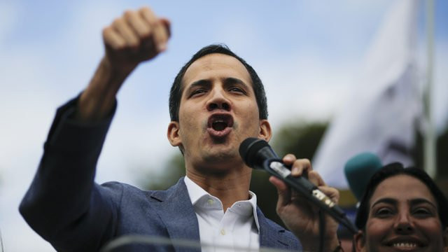 Juan Guaido speaking into microphone.jpg_31344142_ver1.0_640_360 3