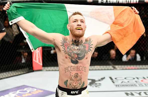 Ha knock-out doi thu, ‘ga dien’ McGregor di vao lich su UFC hinh anh 5