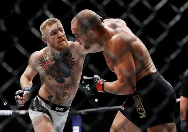 Ha knock-out doi thu, ‘ga dien’ McGregor di vao lich su UFC hinh anh 2