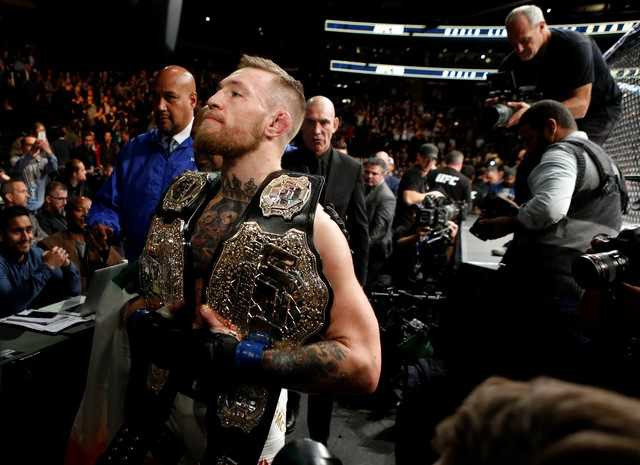 Ha knock-out doi thu, ‘ga dien’ McGregor di vao lich su UFC hinh anh 8