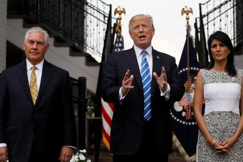 U.S. President Donald Trump, flanked by Secretary of State Rex Tillerson (L) and U.S. Ambassador to the United Nations Nikki Haley (R) speaks to reporters after their meeting at Trumps golf estate in Bedminster, New Jersey U.S. August 11, 2017. REUTERS/Jonathan Ernst