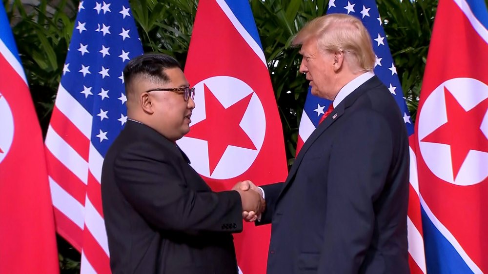 180611204213-02-trump-kim-handshake-0611-screengrab 12