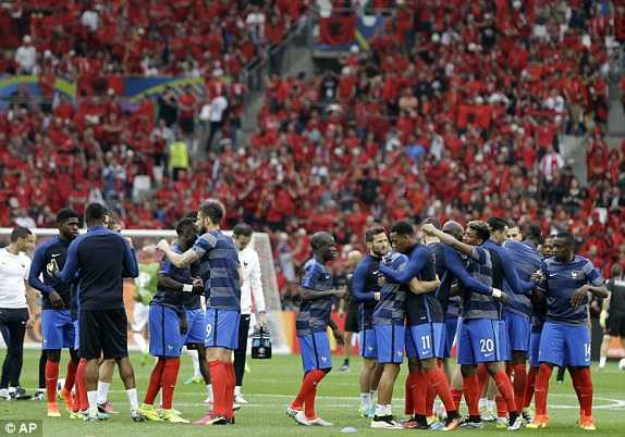 1466015855529_lc_galleryImage_French_players_hug_each_o