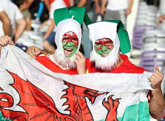 1466446606992_lc_galleryImage_Wales_fans_in_the_stands_