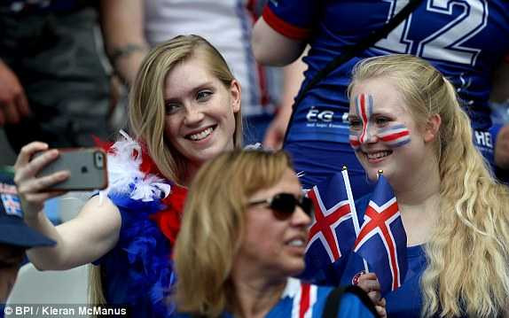 1466608766289_lc_galleryImage_Iceland_fans_take_a_selfi