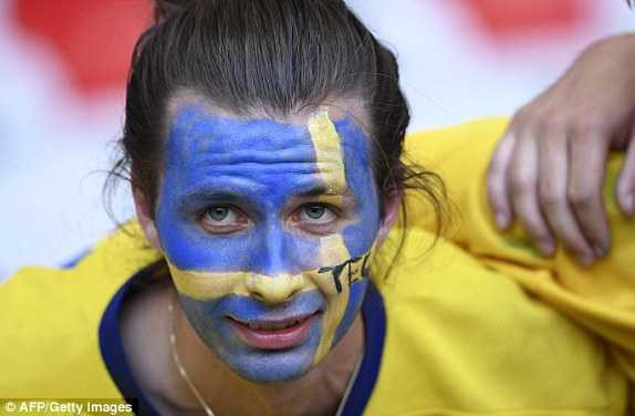 1466619889238_lc_galleryImage_A_Sweden_supporter_waits_