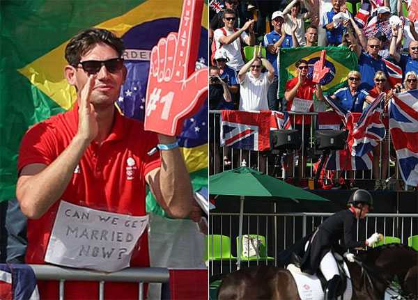 Hôm 15/8, nữ VĐV Charlotte Dujardin đoạt tấm HC vàng đua ngựa cho đoàn thể thao Anh. Bên ngoài đường đua, Dean Wyatt - bạn trai của Charlotte - nhiệt tình cổ vũ cho cô với tấm biển có dòng chữ