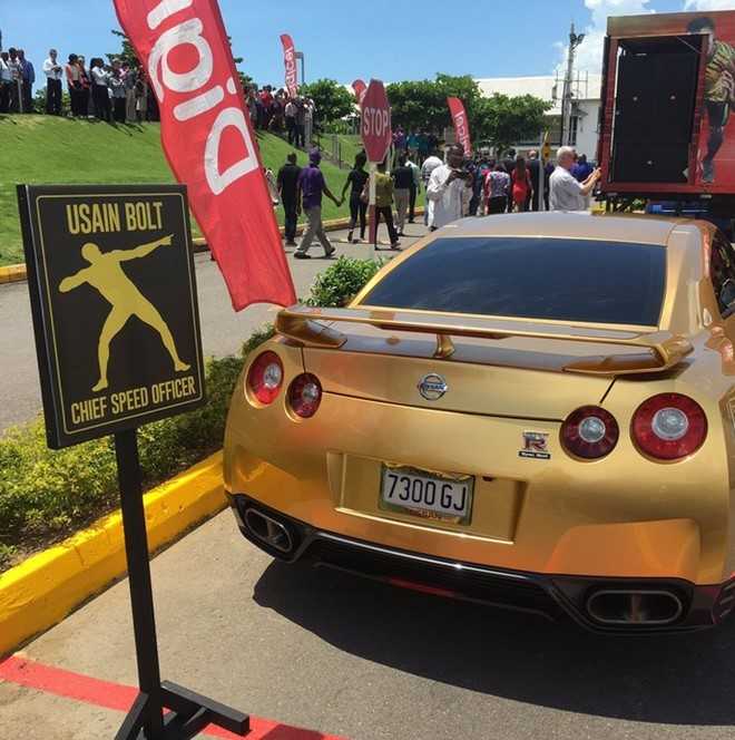 Usain Bolt khoe sieu xe ma vang trong ngay len lam giam doc hinh anh 4