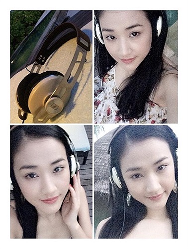 Maya nhí nhảnh đeo tai fone tạo dáng.