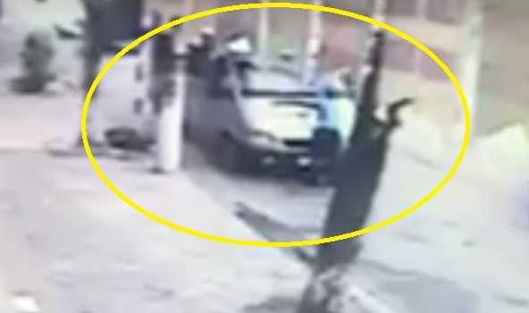 Hình ảnh anh Thành đánh đu trên cần gạt nước. Ảnh cắt clip