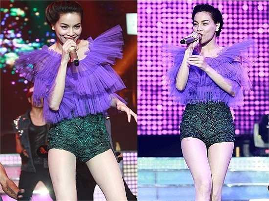 Tông màu cam nóng bỏng và tràn đầy năng lượng của Hà Hồ trên sân khấu.