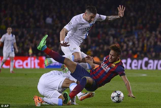 Piling in: Joleon Lescott (left) makes a risky challenge on Neymar as Kolarov clears up
