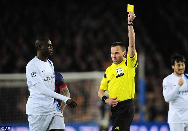 In the book: Referee Stephane Lannoy shows a yellow card to Fernandinho in the opening minutes