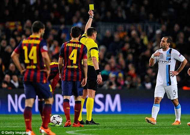 Not happy: Pablo Zabaleta is shown another booking as City struggled to stay on their feet early on
