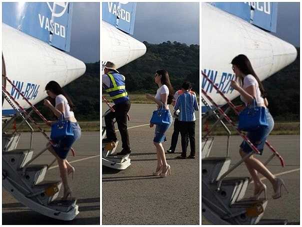 Hình ảnh Ngọc Trinh mặc sành điệu vất vả bước lên bậc thang bởi đôi giày quá cao.