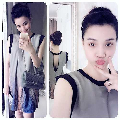 Trang Nhung bụng bầu tạo dáng xì tin.