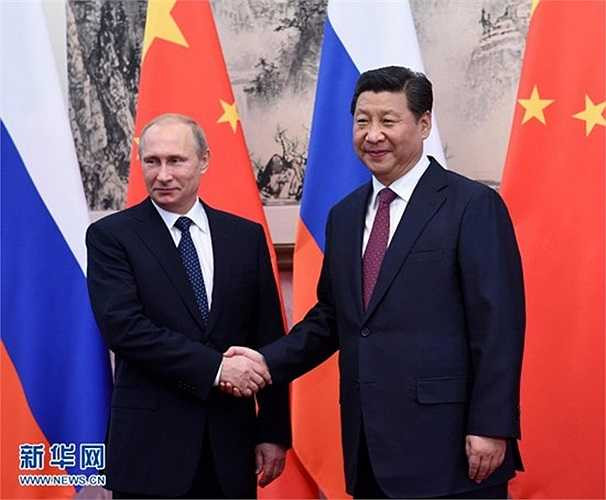 Tổng thống Nga Putin bắt tay Tập Cận Bình
