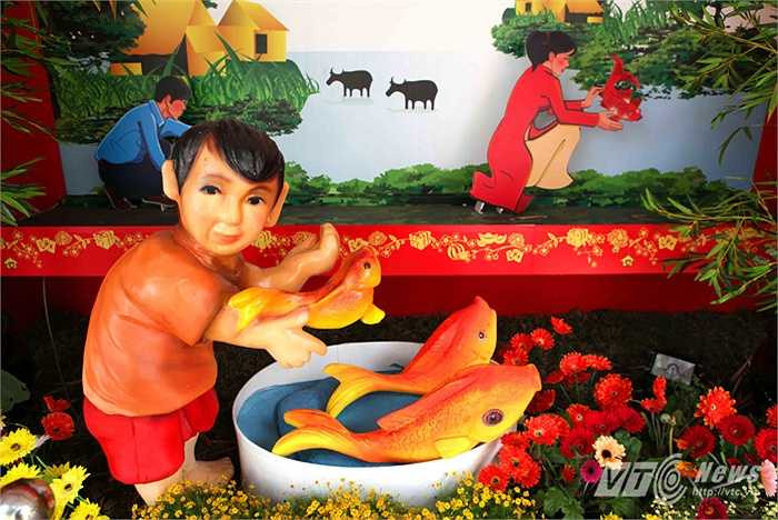 Tục thả cá chép ngày 23 tháng Chạp để Ông Công, Ông Táo về chầu trời. (Ảnh: Quang Minh)