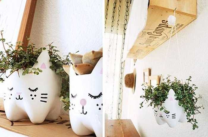 Điểm một số cách trang trí nhà bằng chai nhựa tái chế độc đáo: Bạn có thể tự làm chậu hoa trang trí nhà dễ thương từ vỏ chai nhựa bằng cách cắt ra phần dưới của chai rồi sơn màu trắng cho nó. Sau đó, bạn hãy vẽ thêm các chi tiết nhỏ mà mình thích.