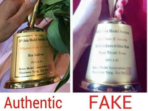 Chiếc cúp của Ngọc Trinh cũng khác, lúc chụp ảnh tập thể thì không có cúp nữa