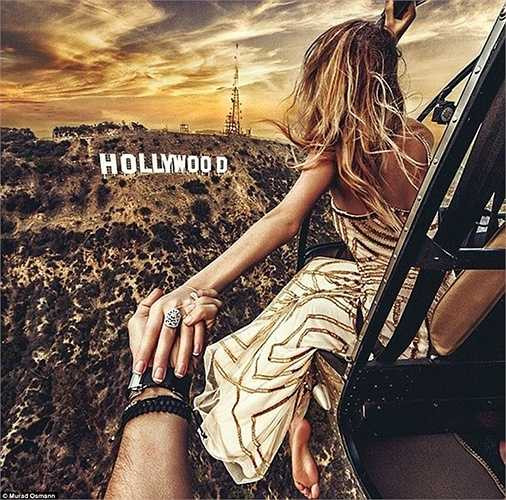 Nhiếp ảnh gia người Nga Murad Osmann cùng vị hôn thê của mình Natalia Zakharova đã đi vòng quanh thế giới để tạo ra những bức ảnh 'Nằm tay em đi khắp thế gian' và hiện đang 'dừng chân' ở Hollywood.