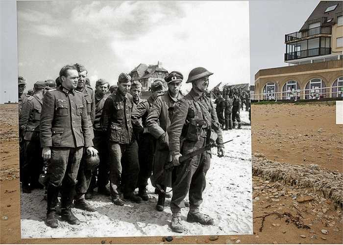 Lính Anh canh giữ những binh sĩ Đức Quốc xã bị bắt làm tù binh trên bãi biển ở thị trấn Bernieres-sur-Mer