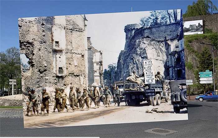Một nhóm binh lính Mỹ đi dọc theo con đường ở Saint-Lo, Pháp hồi tháng 7/1944