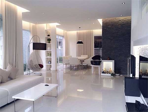Phòng khách tạo cảm giác thoáng mát và rộng rãi. Hai màu đen trắng kết hợp rất ưa nhìn.
