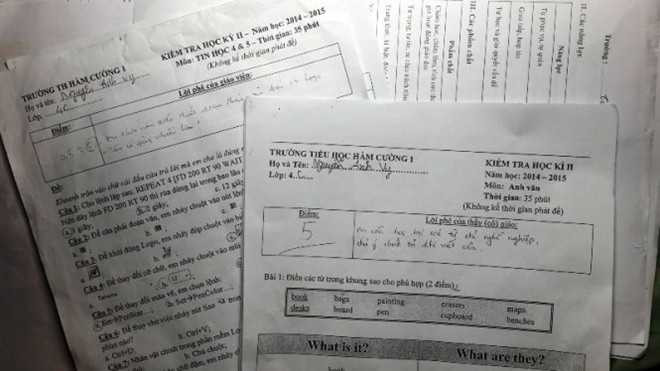 Các bài thi tiếng Anh, tin học không phải do học sinh Vinh làm mà được giáo viên đưa cho học sinh khác làm rồi cho điểm, ghi lời phê vào “y như thật”. Ảnh: Tuổi Trẻ.