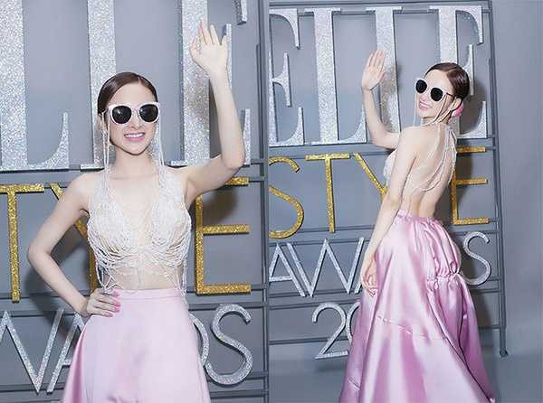 Trên thảm đỏ Lễ trao giải Phong cách Elle 2015, Angela Phương Trinh khoe eo thon với chân váy hồng mướt mắt và chiếc áo lửng gợi cảm phủ đá lấp lánh.