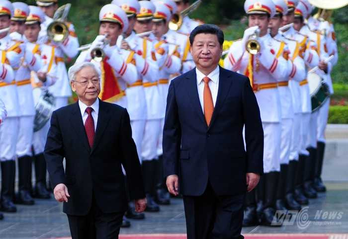 Tổng Bí thư Nguyễn Phú Trọng và Tổng Bí thư, Chủ tịch Trung Quốc Tập Cận Bình - Ảnh: Tùng Đinh