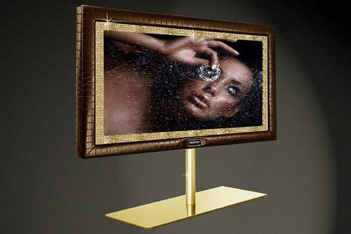 3. Stuart Hughes Prestige HD Supreme Edition: 1,5 triệu USD. Lại một chiếc TV được ‘chạm trổ’ siêu tỉ mỉ và đắt giá. Toàn bộ khung của nó được tạo nên từ 19 kg vàng nguyên chất và 48 viên kim cương, đá quý. 